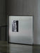 Square steel wall art panels arranged as a gallery wall grid